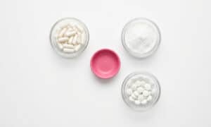 Magnesium supplement capsules and powder arranged for a 2026 sleep and anxiety guide