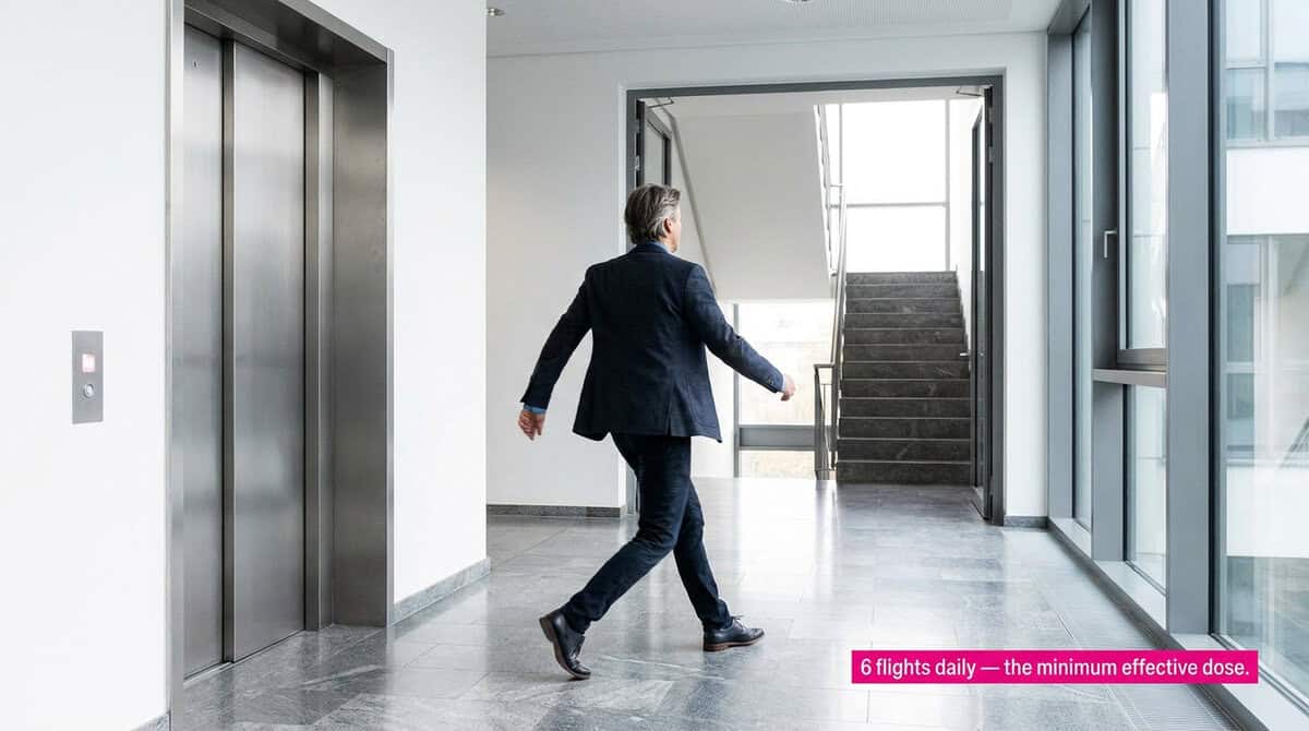 Person choosing stairs over elevator — representing the stair climbing heart health benefit of 39% lower cardiovascular death from the UEA 2026 480,000-person meta-analysis.